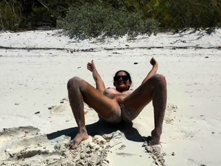 Busty babe playing with her huge boobs