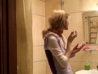 Foxy blonde floozy Katie (aka Lolly) is displaying her tits