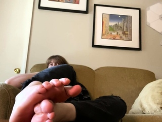 Brunette with foot fetish rubs massive dick with her feet in POV