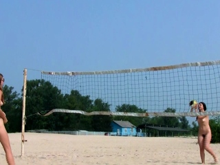 Dashing young nudist chicks have enjoyable at the beach