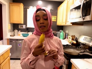 Lily Starfire on her knees sucking massive cock