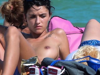 Beautiful single brunette shows off her tits in public