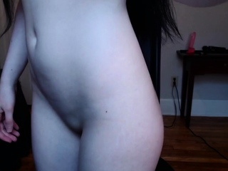 Busty babe playing with her massive boobs