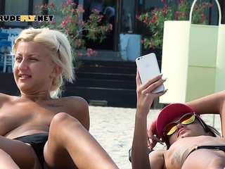 Curvy nude beach girl enjoys her day by the sea