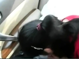 Asian older couple within the automotive