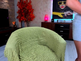 Busty curly brunette with massive boobs fucks on sofa