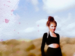 Attractive muse reveals her tits within the desert