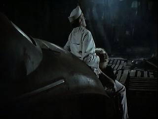 Jennifer Jason Leigh going topless at a bar, stumbling