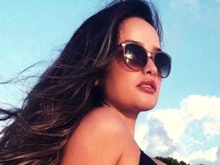 Sizzling brunette babe open air in her lingerie fingering herself