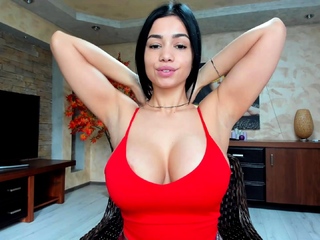 Busty curly brunette with huge boobs fucks on sofa