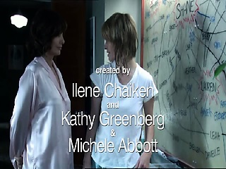 Mia Kirshner crying out loudly and moaning as she sits on a